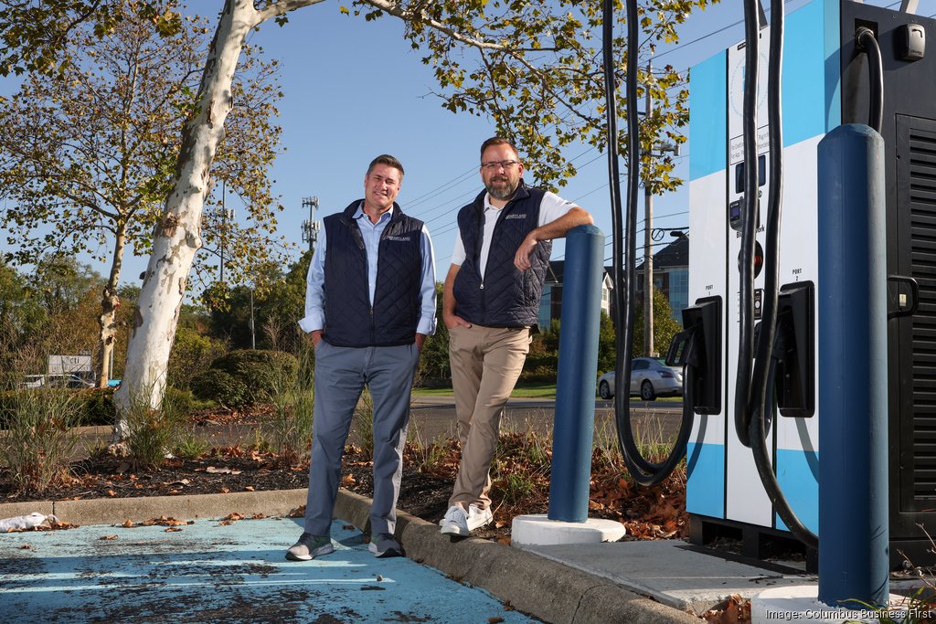 Heartland team members beside EV charging infrastructure in the Midwest