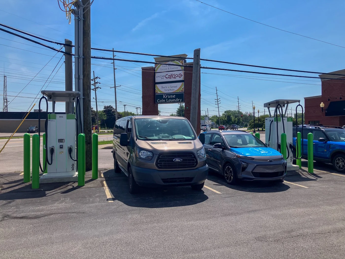 Multiple Blink DC fast chargers at a Heartland commercial installation